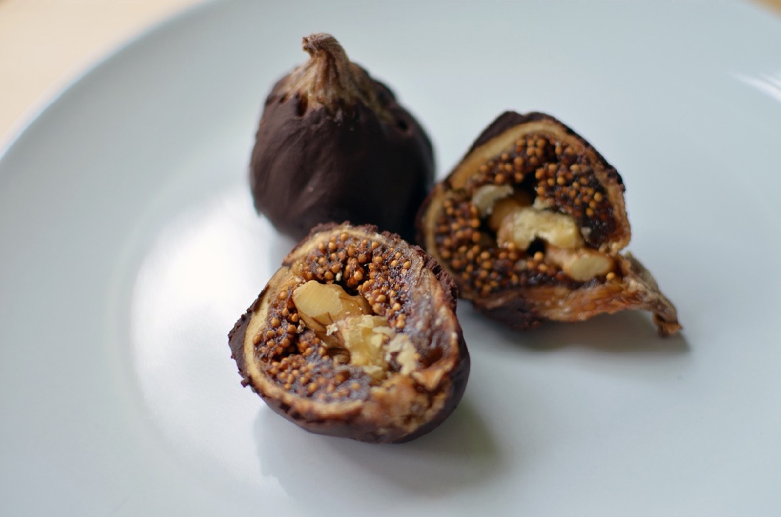 A plated tasting of chocolate-dipped figs