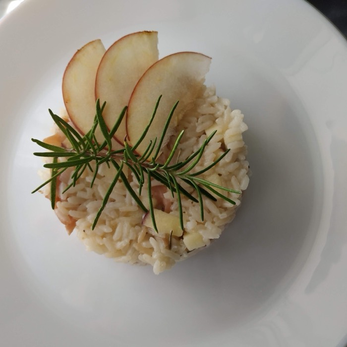 Apple and rosemary risotto plated in a ring