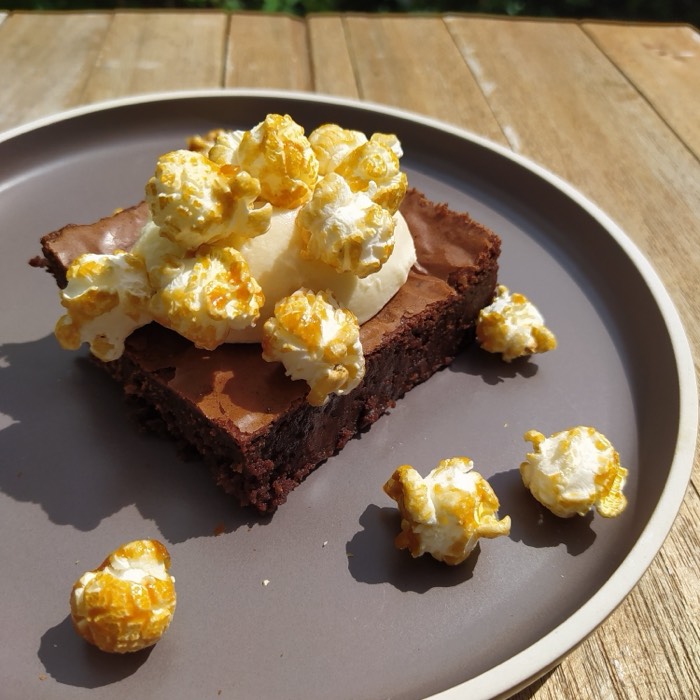 A brownie with caramel popcorn