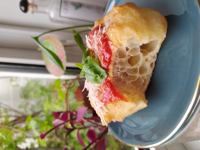 Montanara, Neapolitan fried pizza with tomato, basil and cheese