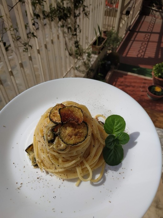 A nest of spaghetti with fried aubergine and mint